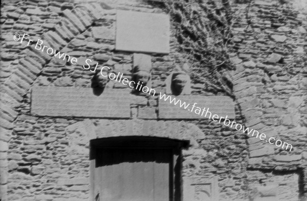 OLD SCULPTURED STONES IN OLD WALL